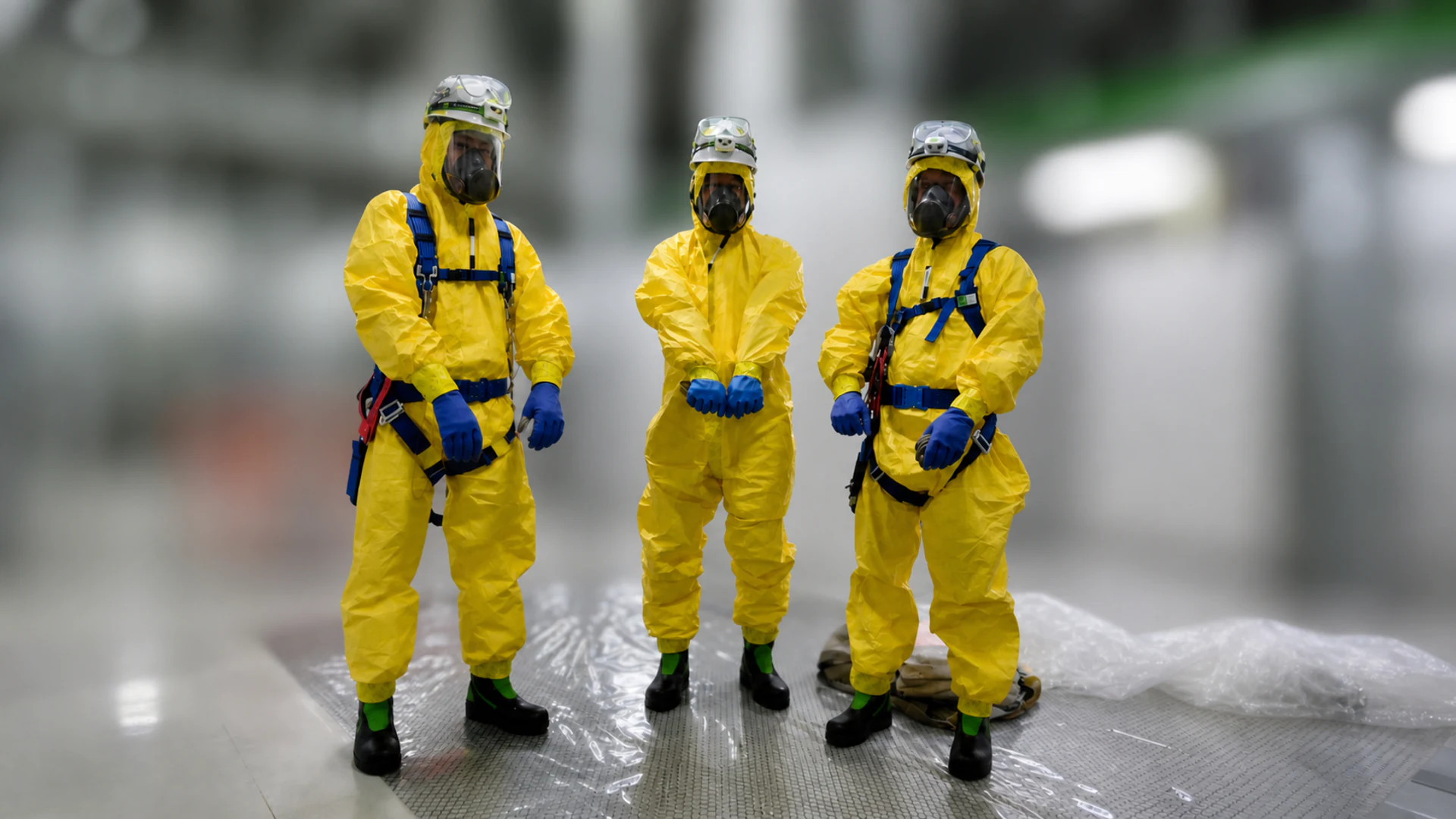 Chemical-resistant PPE being checked before pipe removal